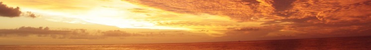 A fiery sunset from a boat at sea