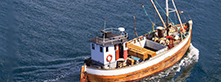 fishing vessel out in the sea cruising